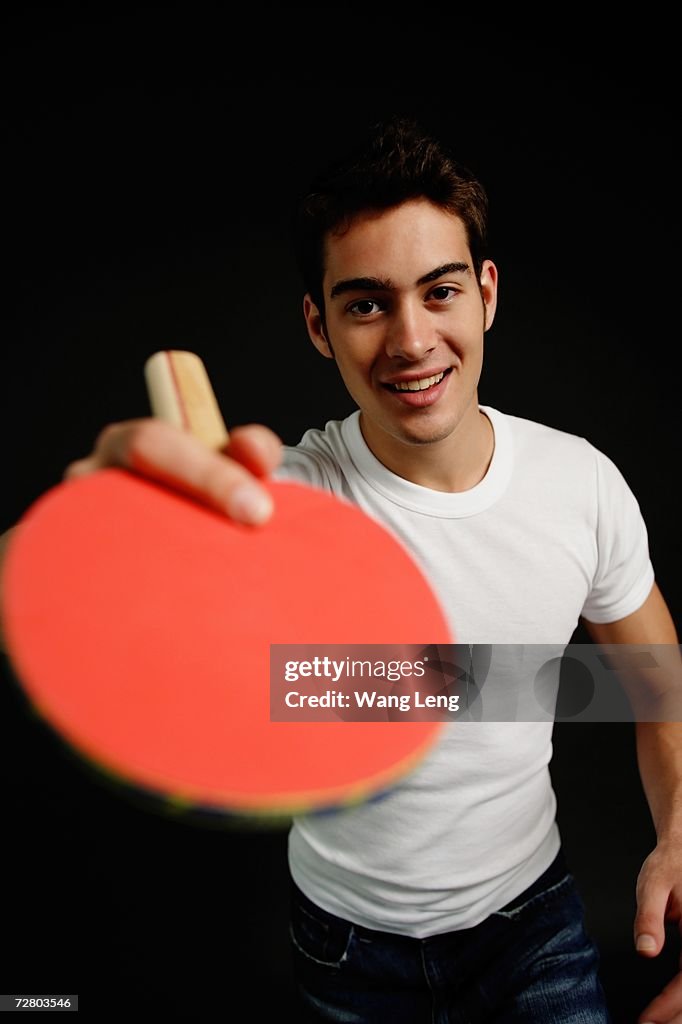 Man holding table tennis racket