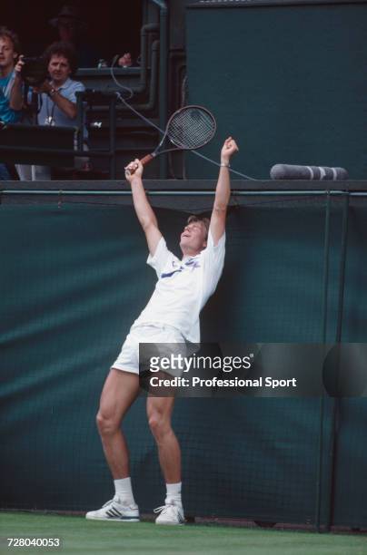 Swedish tennis player Stefan Edberg raises his arms in the air in celebration during progress to reach the final of the Men's Singles tournament to...
