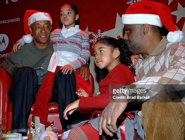 Russell Simmons, Ming Lee Simmons, Aoki Lee Simmons and Danny Simmons attend the Rush Philanthropic Arts Foundations Youth Holiday Party at Irving...