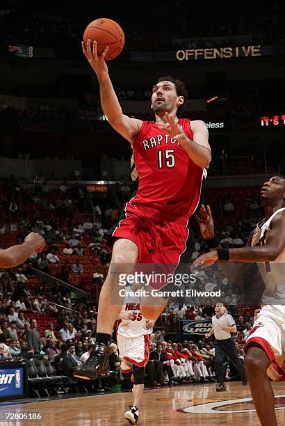 Jorge Garbajosa of the Toronto Raptors goes to the basket against the Miami Heat at the America Airlines Arena December 11, 2006 in Miami, Florida....