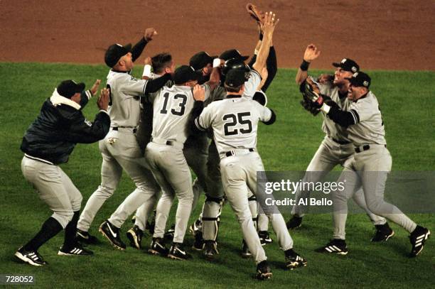 The New York Yankees celebrate their World Series clinching victory in Game 5 of the World Series at Shea Stadium in Flushing, New York. The Yankees...