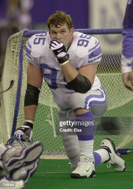 Jared DeVries of the Detroit Lions watches the final minute of the game from the bench against the Indianapolis Colts at the RCA Dome in...