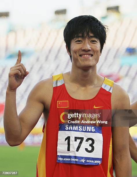 Liu Xiang celebrates after he won the Men's 110m Hurdles final during the 15th Asian Games Doha 2006 at the Khalifa Stadium December 11, 2006 in...