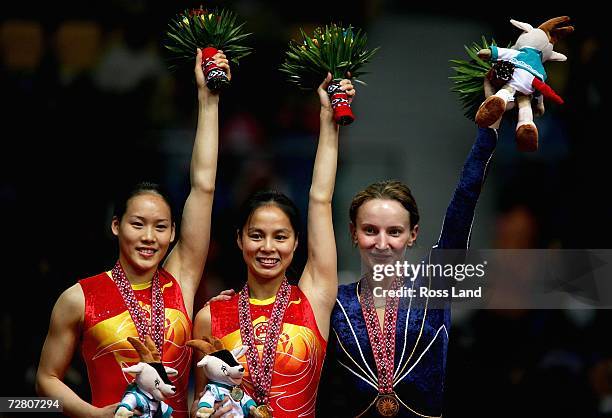 Silver Medal winner Zhong Xingping of China, Gold Medal winner Huang Shanshan of China and Bronze Medal winner Ekaterina Khilko of Uzbekistan...