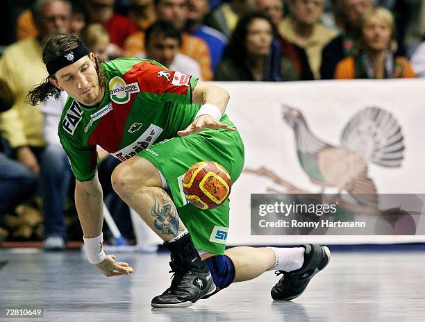 Stefan Kretzschmar of Magdeburg plays the ball during the German Cup game between SC Magdeburg and VFL Gummersbach at the Boerdeland Hall on December...