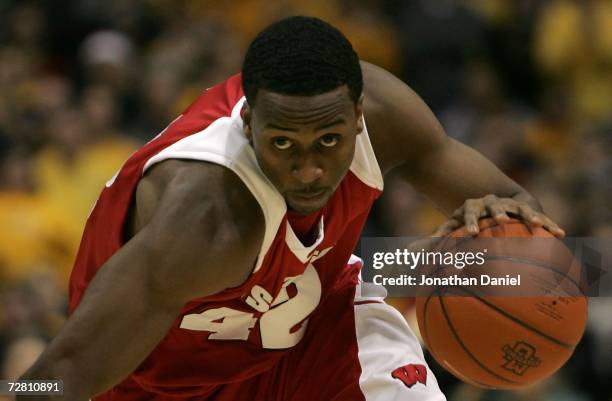 Alando Tucker of the Wisconsin Badgers drives against the Marquette Golden Eagles December 9, 2006 at the Bradley Center in Milwaukee, Wisconsin....