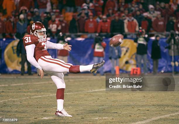 Michael Cohen of the Oklahoma Sooners punts the ball against the Nebraska Cornhuskers during the 2006 Dr. Pepper Big 12 Championship on December 2,...