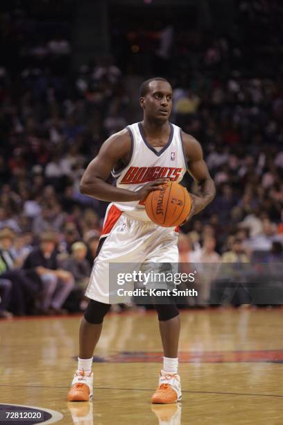 Brevin Knight of the Charlotte Bobcats looks to pass during a game against the Miami Heat at the Charlotte Bobcats Arena on November 25, 2006 in...