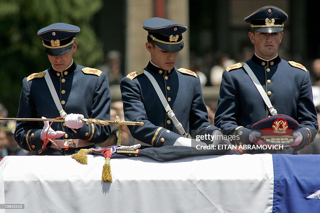 Military cadets put on the coffin of the