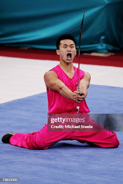 Peng Wei Chua of Chinese Taipei competes in the Men's Nanquan - Three Events Combined Nandao at the 15th Asian Games Doha 2006 at the Aspire Hall on...