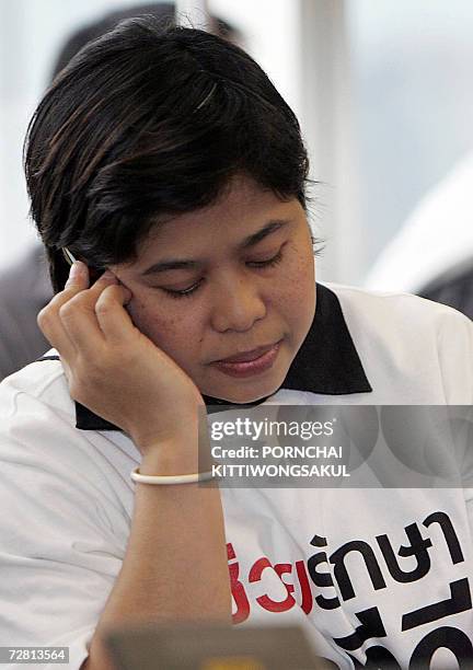 An iTV employee talks on her mobile phone inside the Supreme Administrative Court in Bangkok, 13 December 2006. A Thai broadcaster once linked...