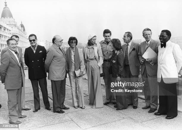 The jury members of the Cannes Film Festival pose on the terrace of the Palais des Festivals, 13th May 1977. From left to right, Maurice Bessy , G....