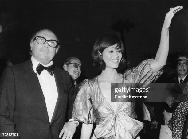Italian director Francesco Rosi presents his film 'Il Caso Mattei' at the Cannes Film Festival, with the assistance of Italian actress Claudia...