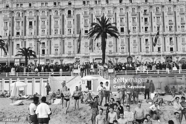 Fans on the seafront outside the Carlton Hotel waiting for film stars to arrive during the Cannes Film Festival, 3rd May 1959.