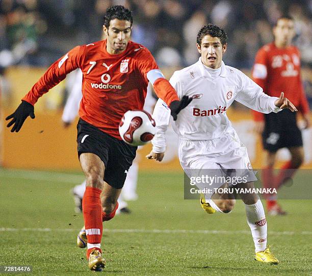 Brazilian SC Internacional forward Alexandre Pato battles for the ball with Egyptian football club Al Ahly defender Shady Mohamed in the semi-final...