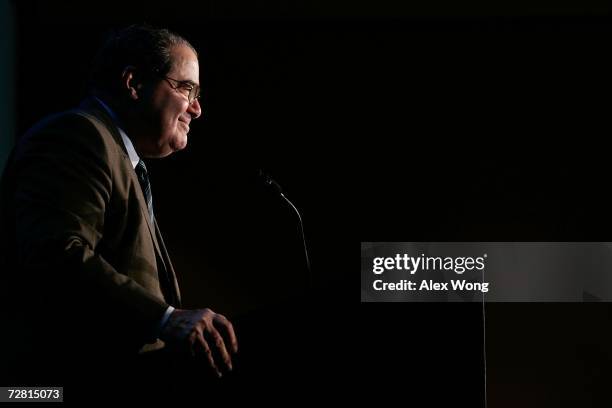 Supreme Court Associate Justice Antonin Scalia smiles as he addresses a Northern Virginia Technology Council breakfast December 13, 2006 in McLean,...