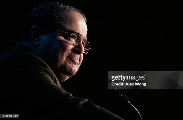 Supreme Court Associate Justice Antonin Scalia pauses as he addresses a Northern Virginia Technology Council breakfast December 13, 2006 in McLean,...