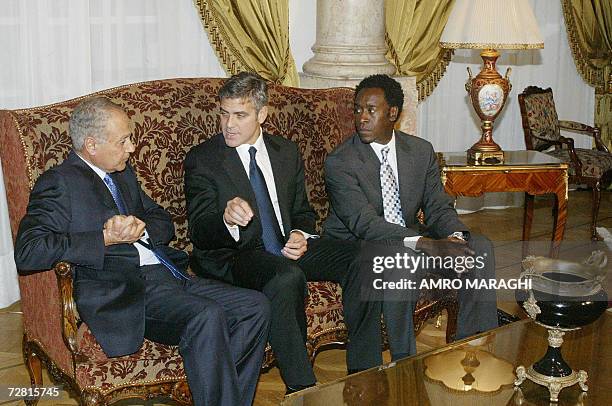 Actors George Clooney and Don Cheadle meet with Egyptian Foreign Minister Ahmed Abul Gheit at the foreign ministry in Cairo 13 December 2006. The...