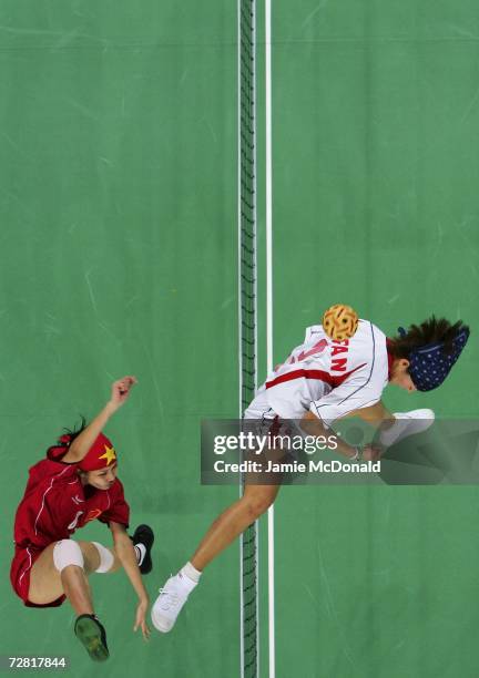 Nguyen Hai Thao of Vietnam in action against Oku Chiharu of Japan during the Sepaktakraw Women's Double Competition during the 15th Asian Games Doha...