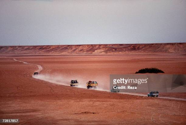 Trucks take schoolchildren for a picnic to Ein Dabban Lake April 2000 in Ein Dabban Lake, Libya.