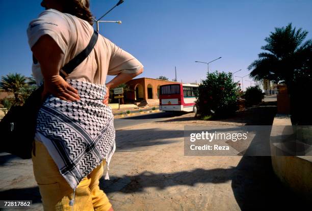 Tourist wears a kaffiyeh around her hips April 2000 in Ghadames, Libya.