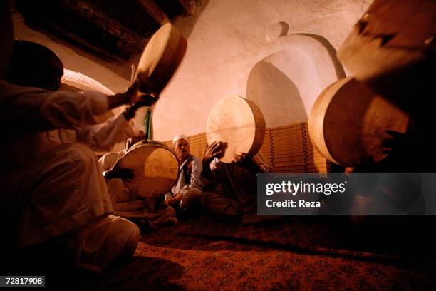 Musicians play the drums and chant at a mosque during a Sufi ceremony April, 2000 in Ghadames, Libya.