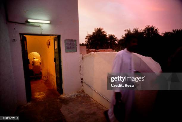 Muslims perform their ablutions before their evening prayer at the mosque April, 2000 in Ghadames, Libya.