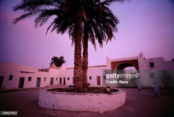 Two palm trees stand in the middle of the Market Square April, 2000 in Ghadames, Libya.