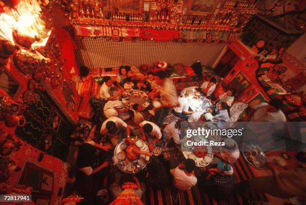 Group of Korean tourists have lunch in a typical traditional home April, 2000 in Ghadames, Libya.