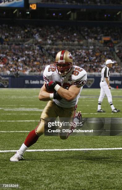 Tight end Eric Johnson of the San Francisco 49ers goes in for a touchdown against the St. Louis Rams at the Edward Jones Dome on November 26, 2006 in...