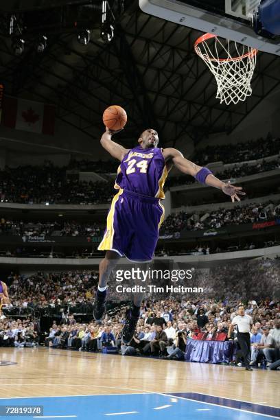 Kobe Bryant of the Los Angeles Lakers dunks the ball against the Dallas Mavericks on December 13, 2006 at the American Airlines Center in Dallas,...