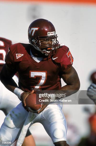 Michael Vick of the Virginia Tech Hokies moves with the ball during the game against the Pittsburgh Panthers at Blacksburgh, Virginia. The Hokies...