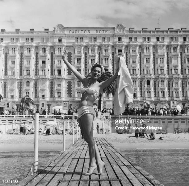 Polish actress Bella Darvi poses in front of the Carlton Hotel during the Cannes Film Festival, 12th May 1956. Original Publication : Picture Post -...