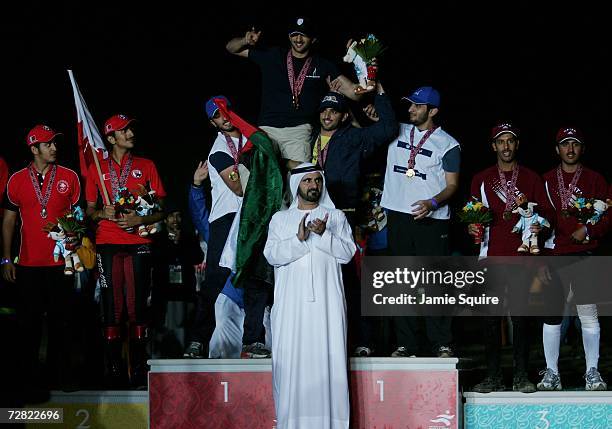 Sheikh Ras. Al Maktoum of United Arab Emirates is hoisted by teammates after winning the team Gold medal in the Equestrian Endurance race at the 15th...