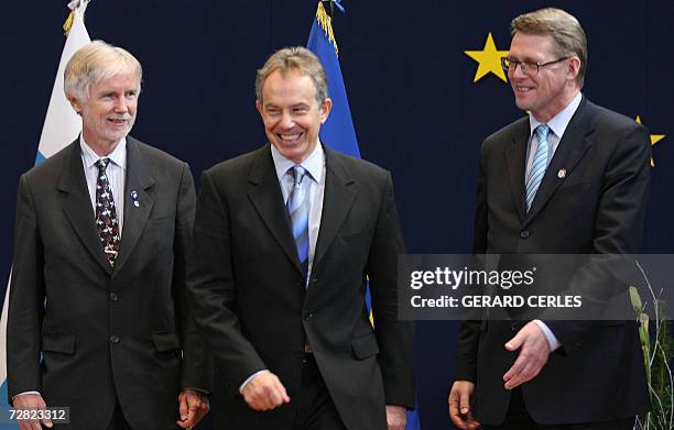 Britain's Prime Minister Tony Blair is greeted by Finland's Prime Minister Maati Vahanen and Finland's foreign minister Erkki Tuomioja prior a...