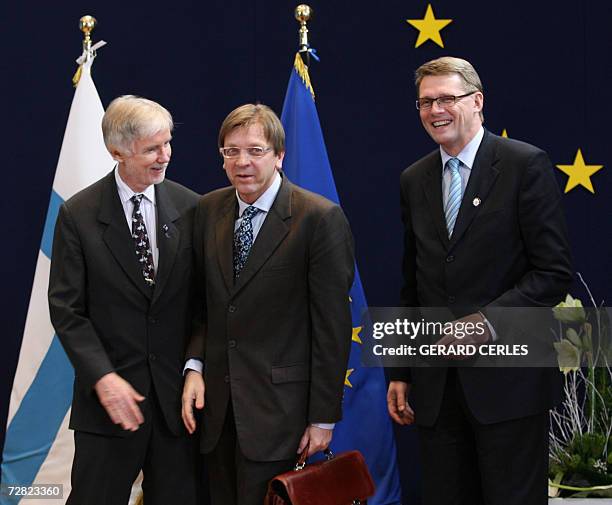 Belgium's Prime Minister Guy Verhofstadt is greeted by Finland's Prime Minister Maati Vahanen and his foreign minister Erkki Tuomioja, whose country...