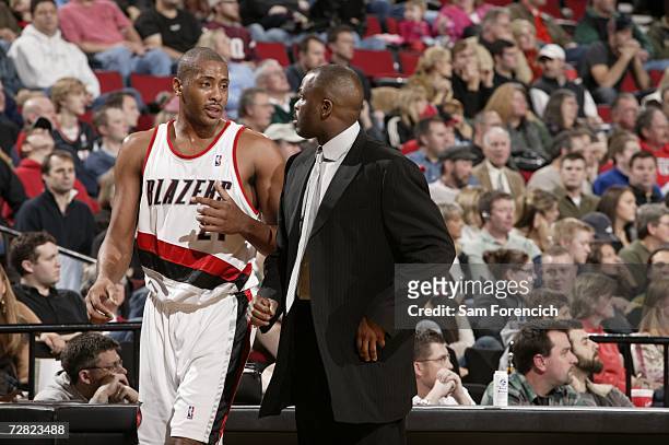 Jamaal Magloire and head coach Nate McMillan of the Portland Trail Blazers discuss play during the NBA game against the New Jersey Nets on November...