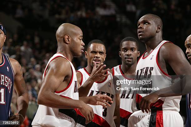 Jarrett Jack, Juan Dixon, Martell Webster and Zach Randolph of the Portland Trail Blazers discuss play during the NBA game against the New Jersey...