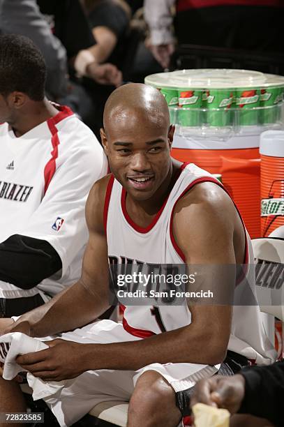 Jarrett Jack of the Portland Trail Blazers smiles as he sits on the bench during the NBA game against the New Jersey Nets on November 22, 2006 at the...