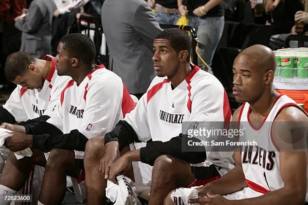 Ime Udoka, Martell Webster, LaMarcus Aldridge and Jarrett Jack of the Portland Trail Blazers sit on the bench during the NBA game against the New...