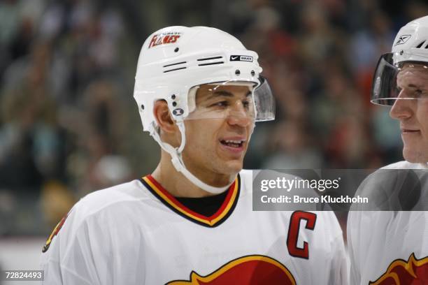 Jarome Iginla of the Calgary Flames smiles in a pause from action against the Minnesota Wild during the game at Xcel Energy Center on December 7,...