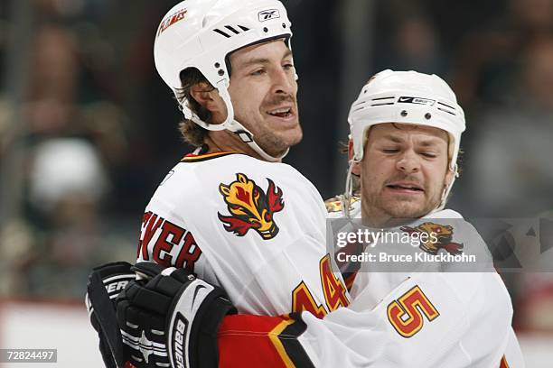 Rhett Warrener of the Calgary Flames celebrates his goal with Byron Ritchie against the Minnesota Wild during the game at Xcel Energy Center on...