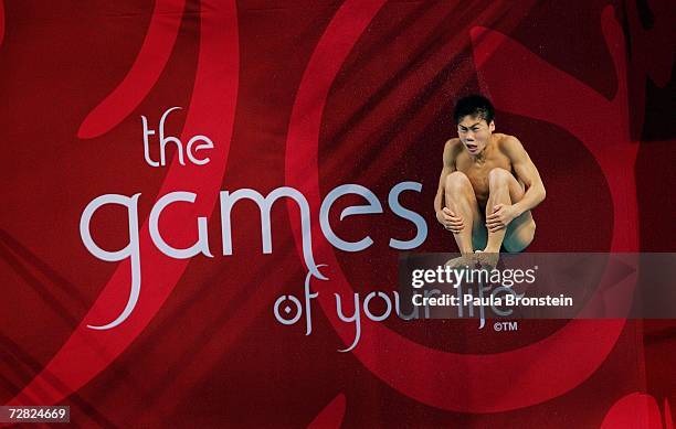 An athlete dives off the 10 meter springboard during diving pratice at the 15th Asian Games in Doha, Qatar December 13, 2006. The games features 45...