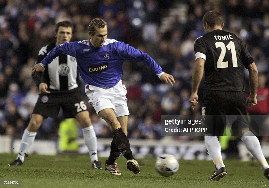 Rangers' Thomas Buffel fights for the ba