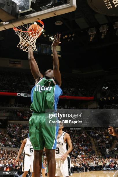 DeSagana Diop of the Dallas Mavericks puts the ball into the basket during the NBA game against the San Antonio Spurs at the AT&T Center on November...
