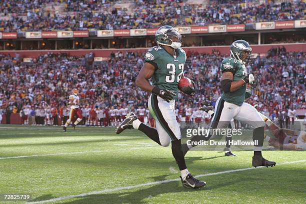 Strong Safety Michael Lewis of the Philadelphia Eagles runs for a touchdown after an interception during the game against the Washington Redskins on...