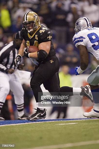 Running back Mike Karney of the New Orleans Saints scores a touchdown against the Dallas Cowboys at Texas Stadium on December 10, 2006 in Irving,...