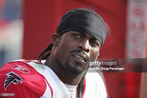 Quarterback Michael Vick of the Atlanta Falcons looks on against the Tampa Bay Buccaneers on December 10, 2006 at Raymond James Stadium in Tampa,...