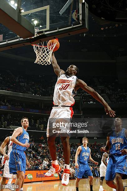 Emeka Okafor of the Charlotte Bobcats dunks over the Orlando Magic on December 14, 2006 at the Charlotte Bobcats Arena in Charlotte, North Carolina....