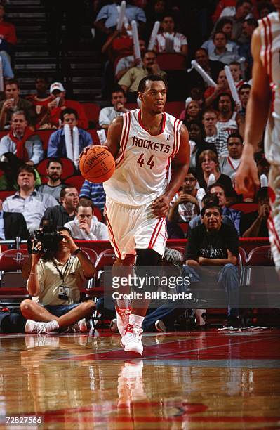 Chuck Hayes of the Houston Rockets moves the ball up court during a game against the Minnesota Timberwolves at the Toyota Center on November 28, 2006...